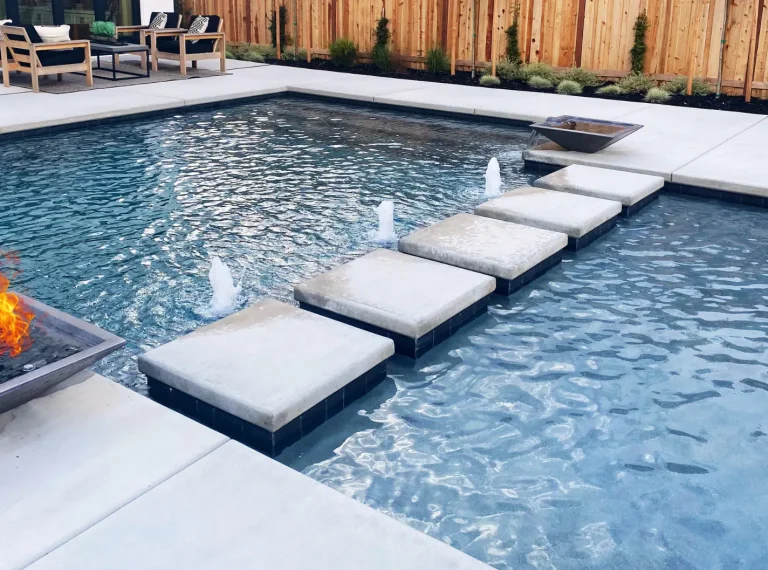 Brenner Pools - backyard luxury swimming pool with stepping stone bridge